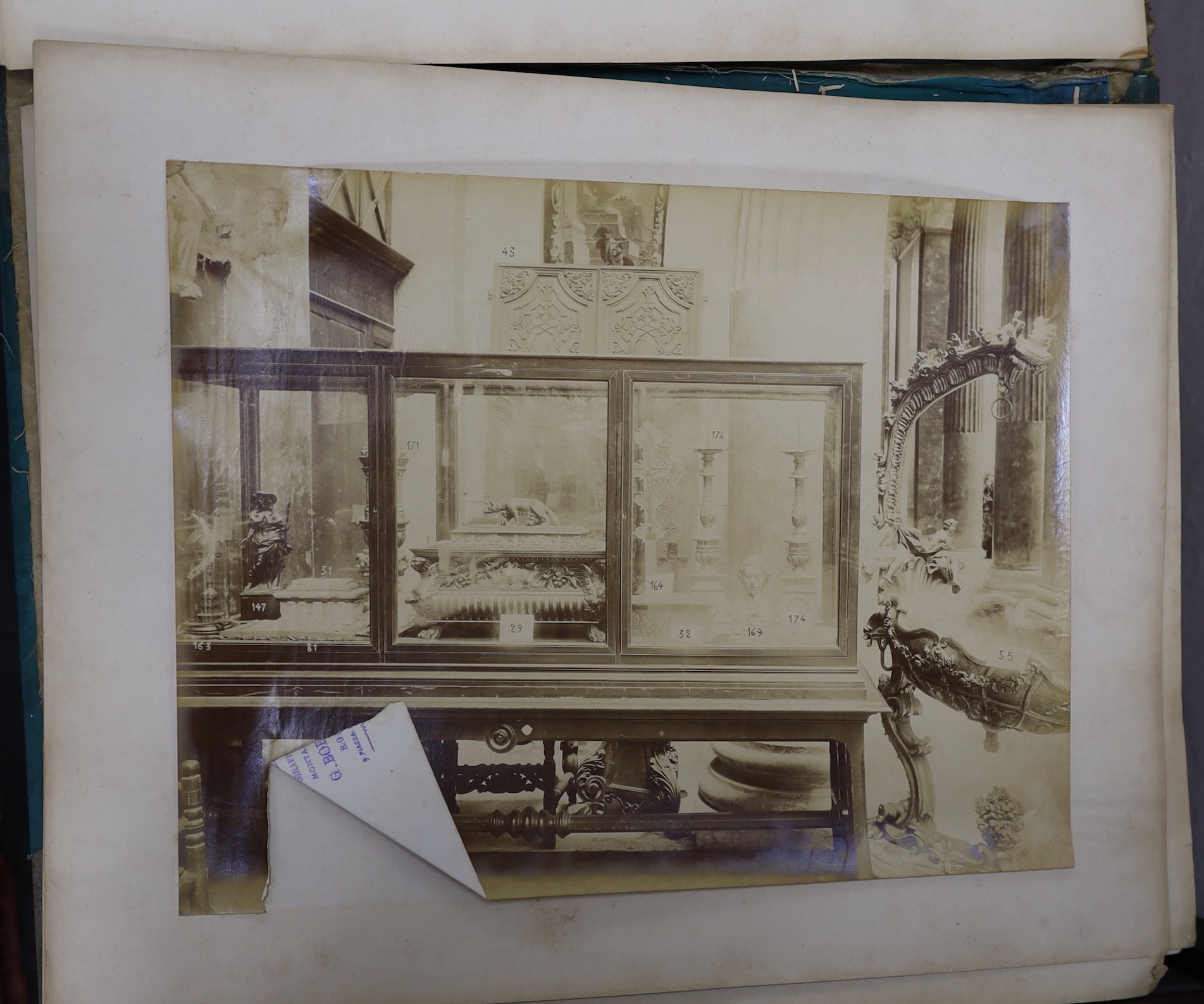 G. Borelli of Rome. A folio of photographs of antiquities and historical artefacts, together with an etching by Hedley Fitton, overall 49 x 38cm